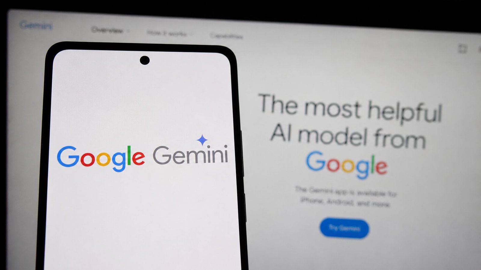 Google Gemini logo displayed on a smartphone screen with Google's AI interface blurred in the background.